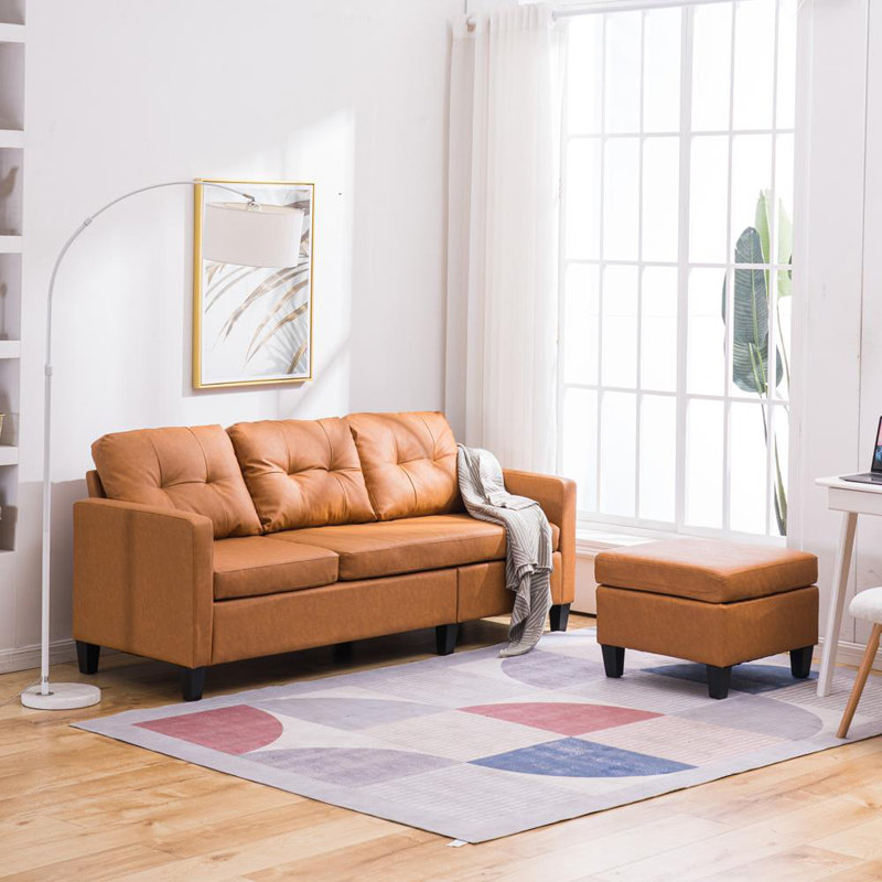 Ebern Designs Adika 77" Wide Faux Leather Reversible Sofa & Chaise with Ottoman Wayfair